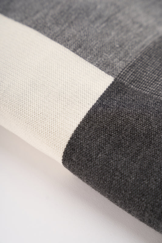 Close-up of the black and grey checked scarf pattern