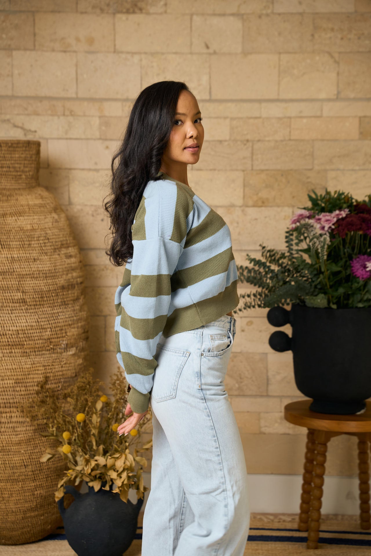 Rida cropped cardigan side profile highlighting cropped hem and loose silhouette