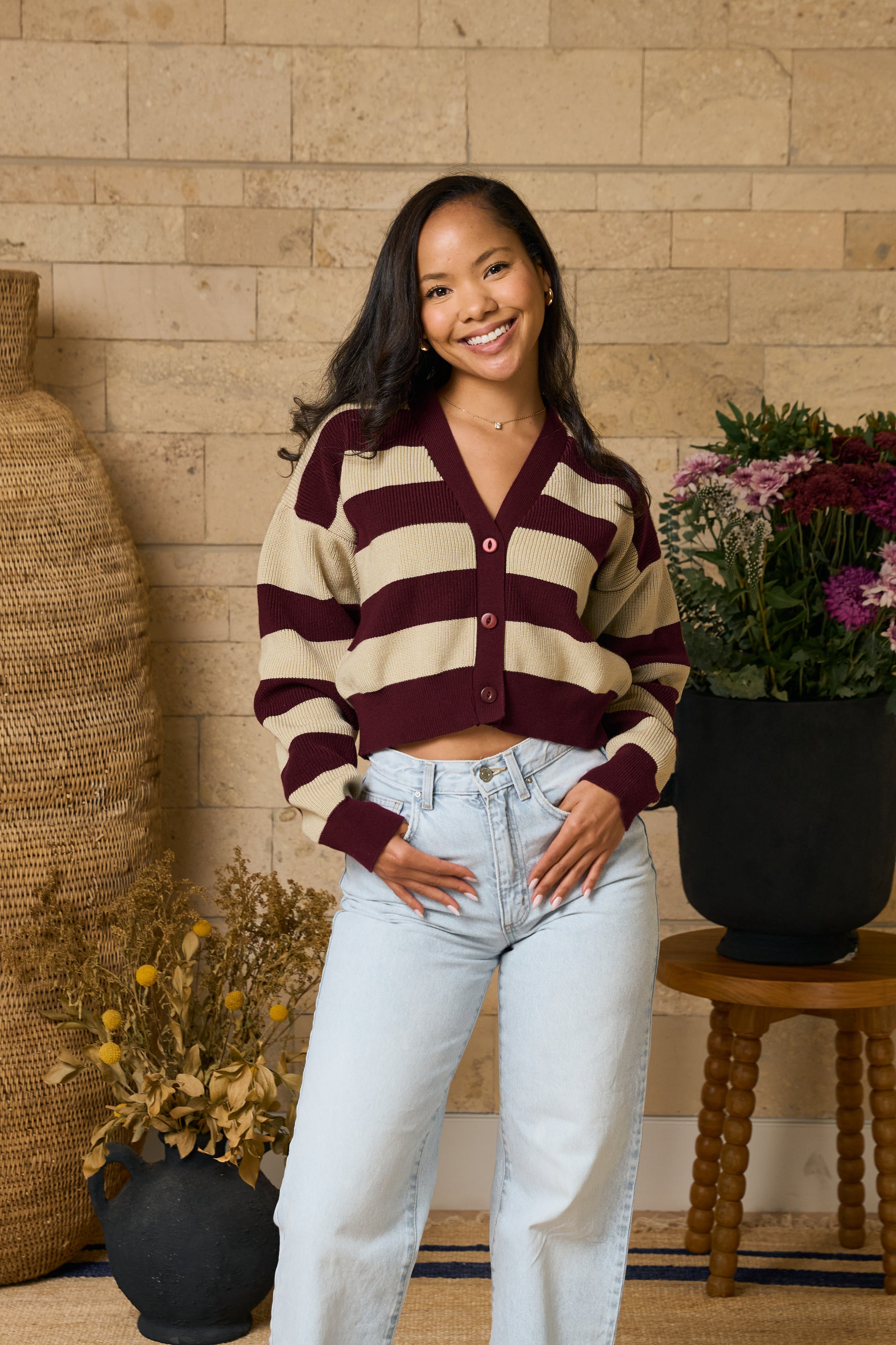 Burgundy striped cropped cardigan for women paired with light blue jeans in Nairobi kenya